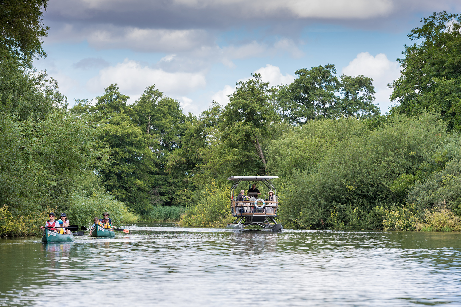 The Ra boat trip travelling down the river on a sunny day