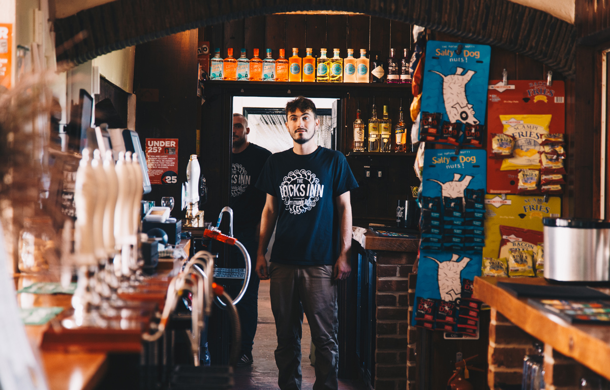 Barman standing inside the Locks Inn