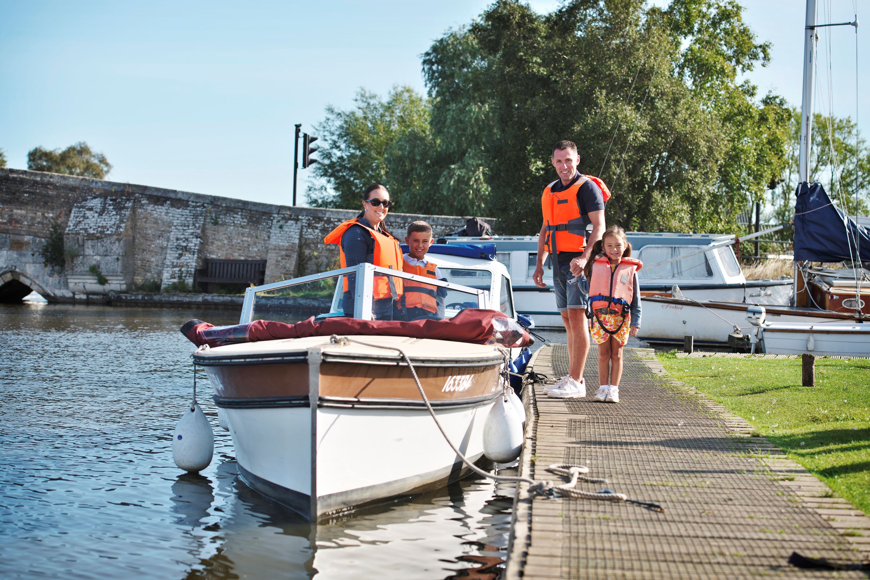 Family with an electric day boat at Potter Heigham
