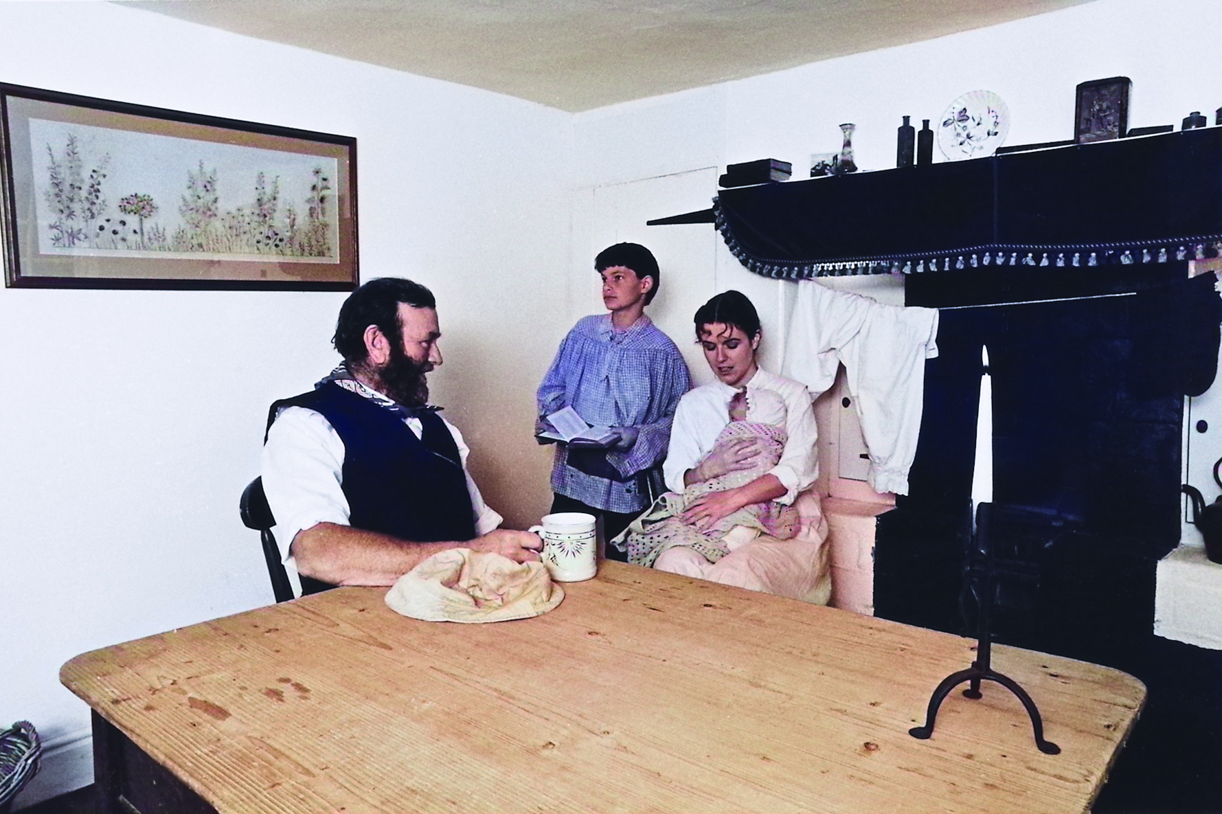 Marshwoman and family downstairs in Toad Hole Cottage