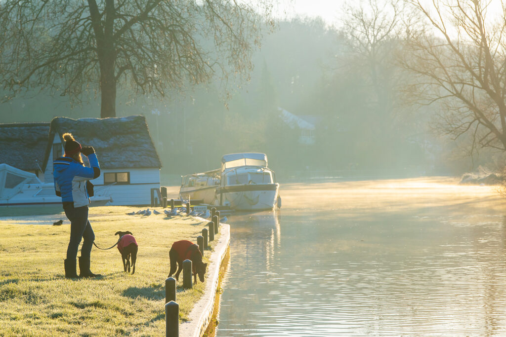 Walking along the scenic River Bure.