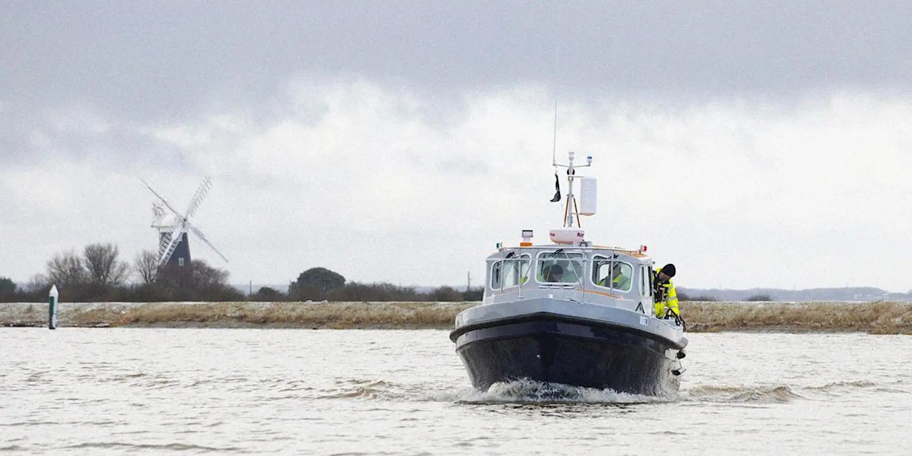 A boat crossing Breydon water in slightly choppy conditions