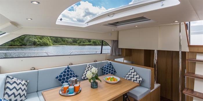 Interior of a Broom Boats luxury cruiser with spacious saloon and seating