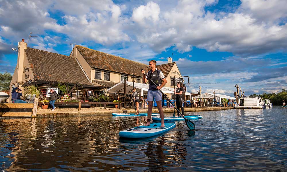 Go Paddle base in Horning with boards and equipment