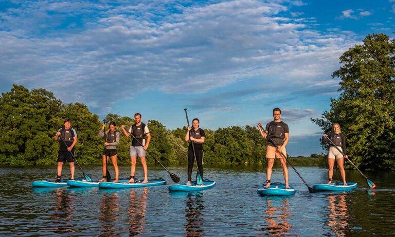 Group paddleboarding experience with Go Paddle Norfolk