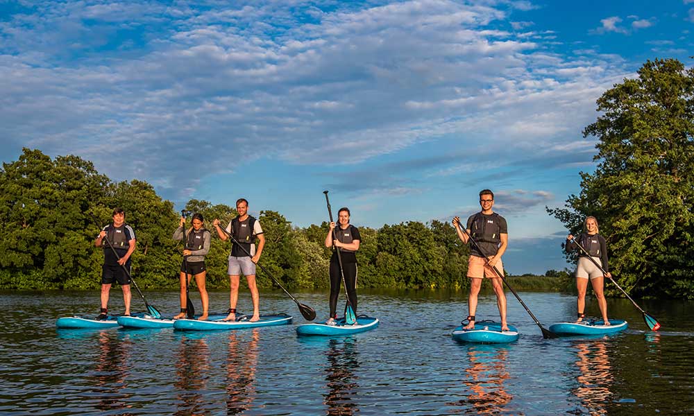 Group paddleboarding experience with Go Paddle Norfolk