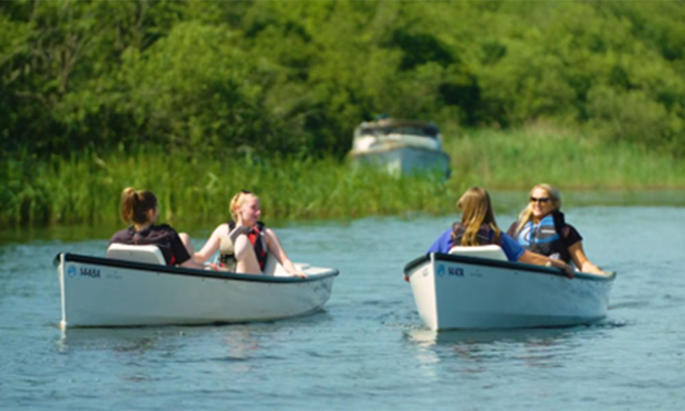 Two pedal boats floating on the Norfolk Broads