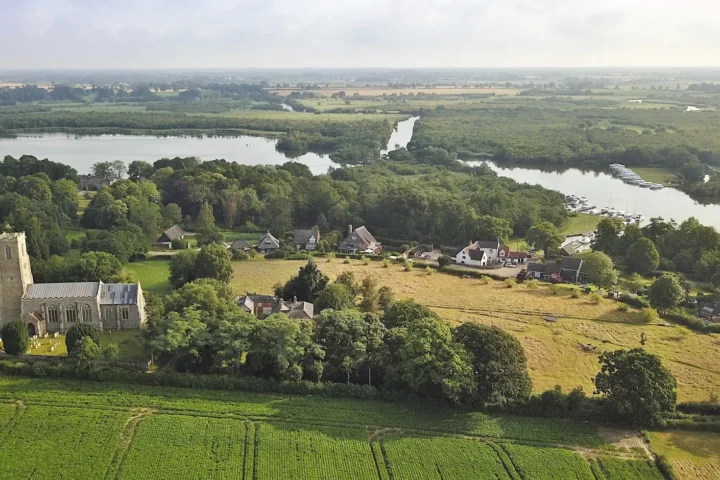 Aerial view of Ranworth Church, with the broad in the background