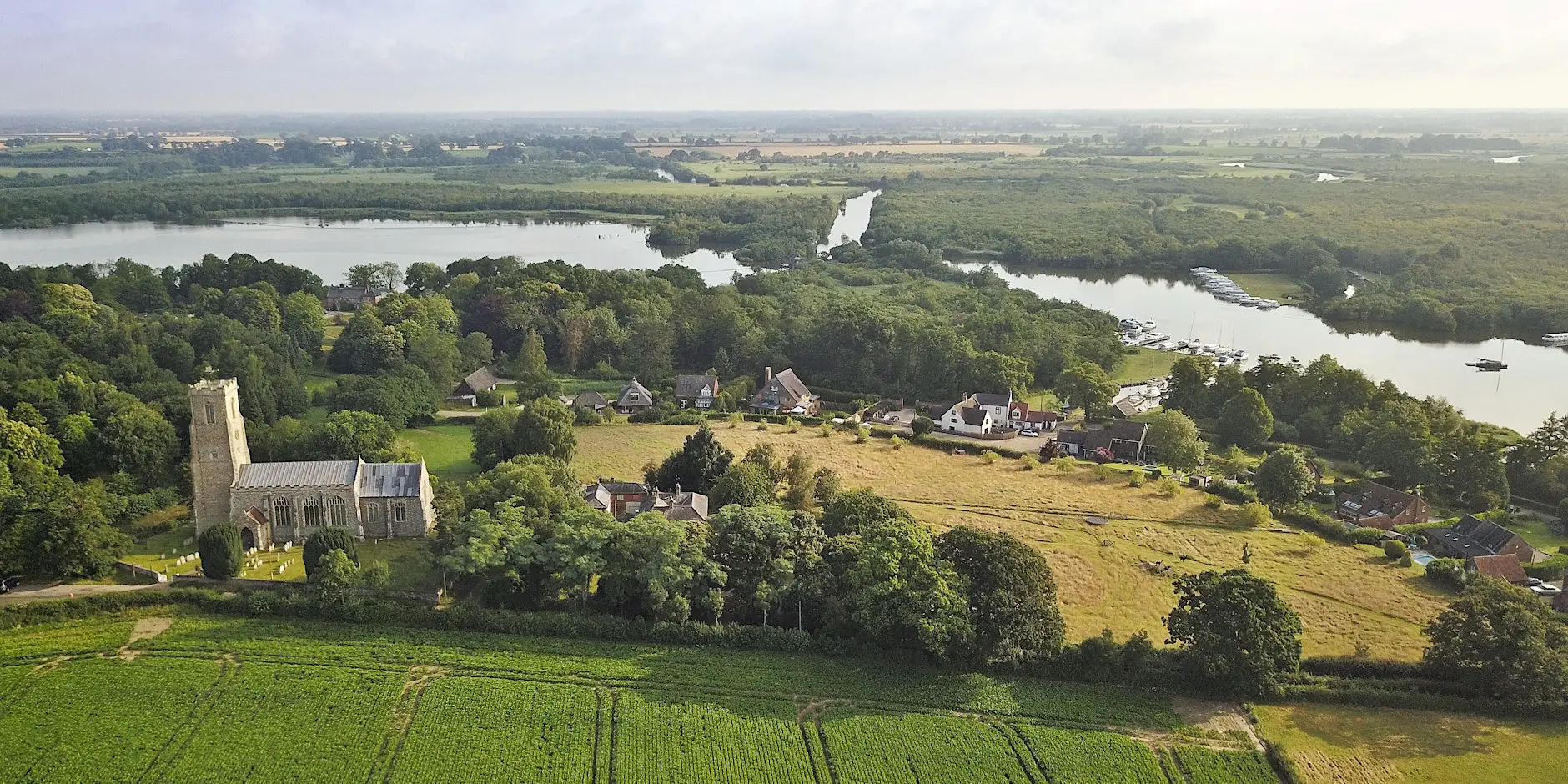 Aerial view of Ranworth Church, with the broad in the background