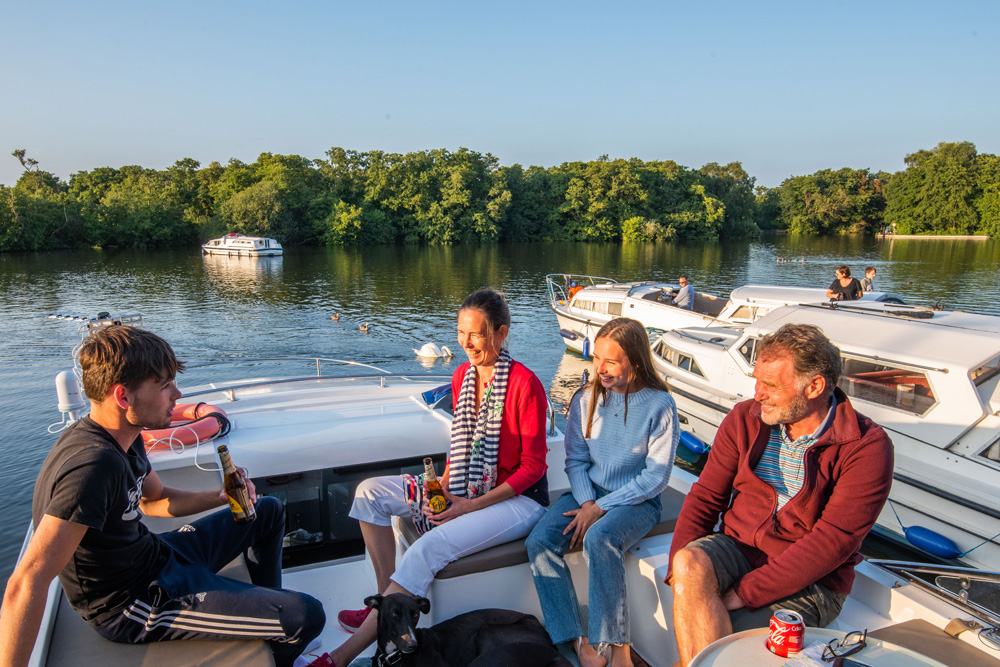 Family aboard a Broads Cruiser at Salhouse Broad