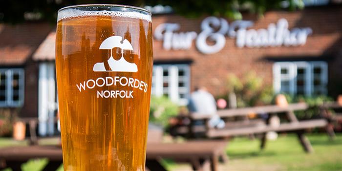 Pint of locally brewed Woodfordes beer