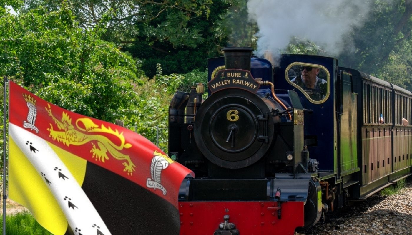 Bure Valley Railway steam train with Norfolk county flag