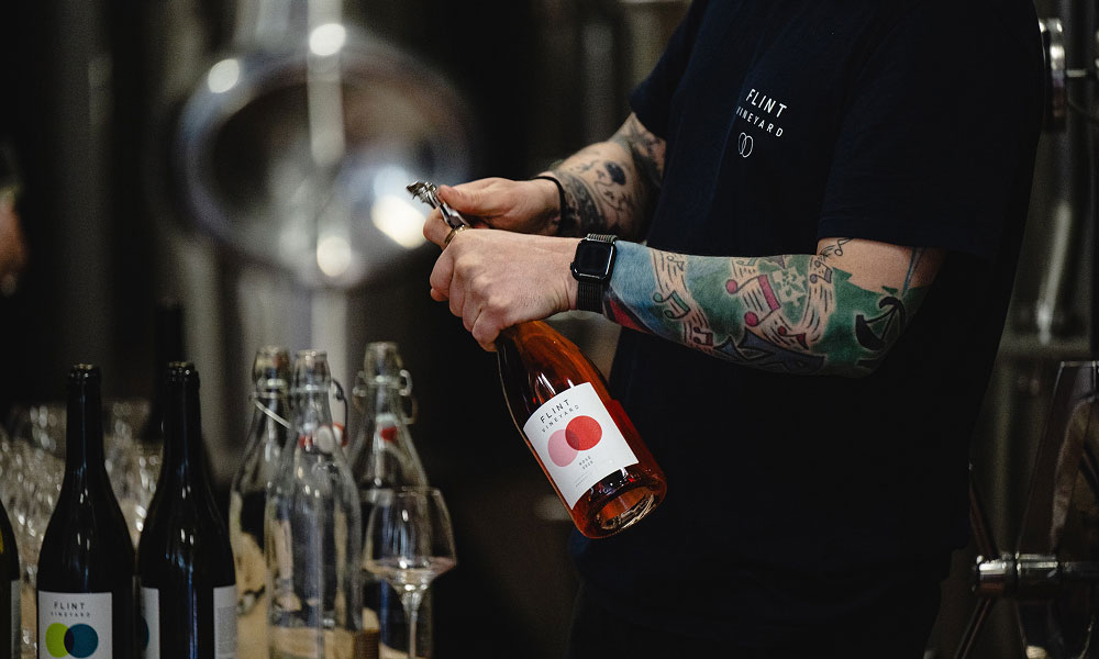 Bottles of wine being opened at Flint Vineyard
