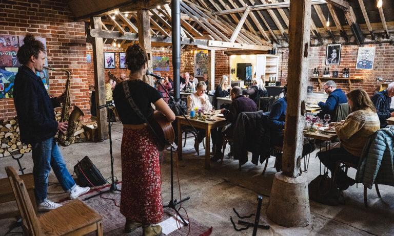 A live band playing in at an event at Flint Vineyard