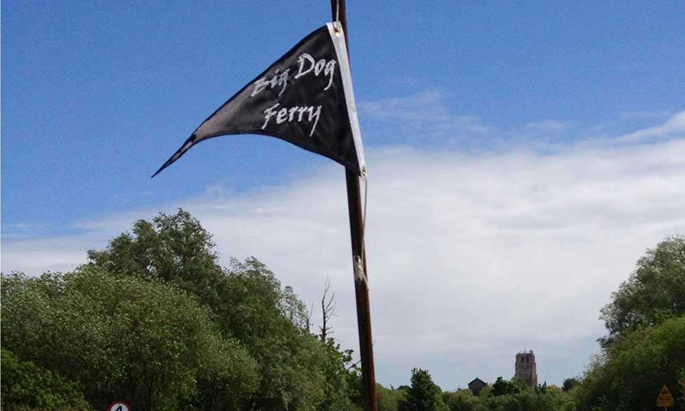 Black flag with white text: Big Dog Ferry