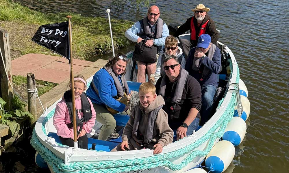 Passengers sat inside Big Dog Ferry on River Waveney